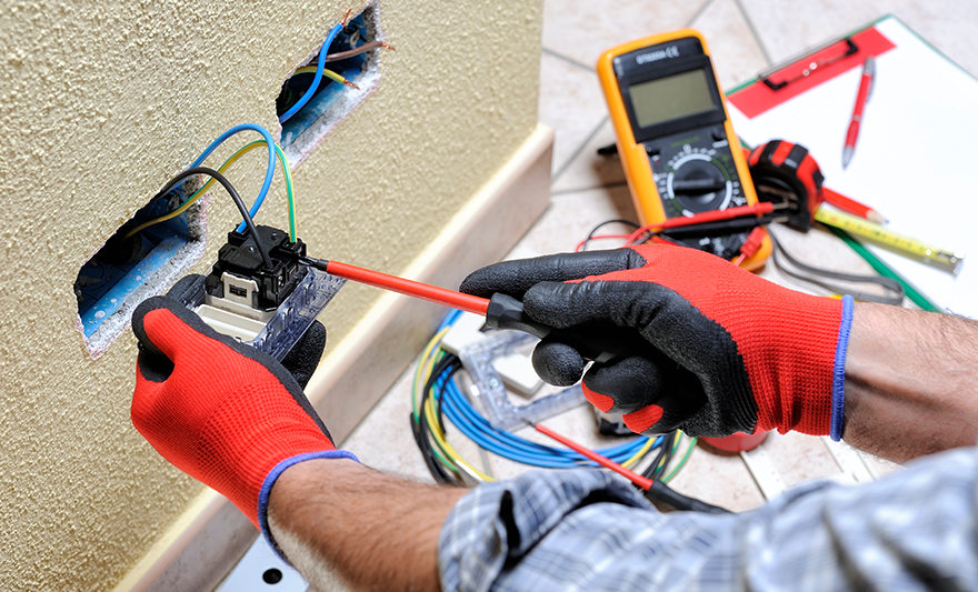Residential Low Voltage Electrical technician working on outlets