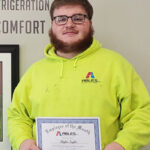 man holding a employee of the month certificate