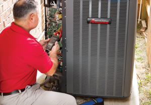 technician works on air conditioner